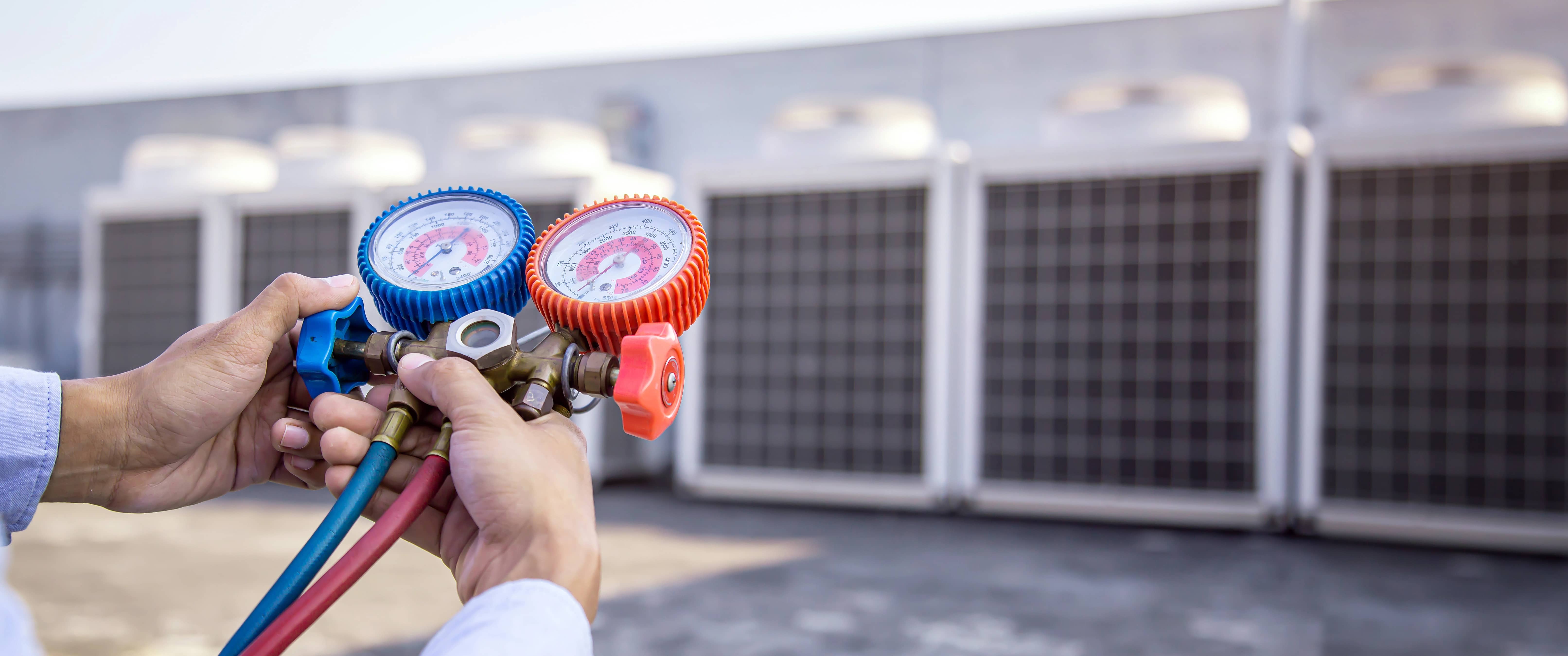 HVAC technician checking commercial equipment